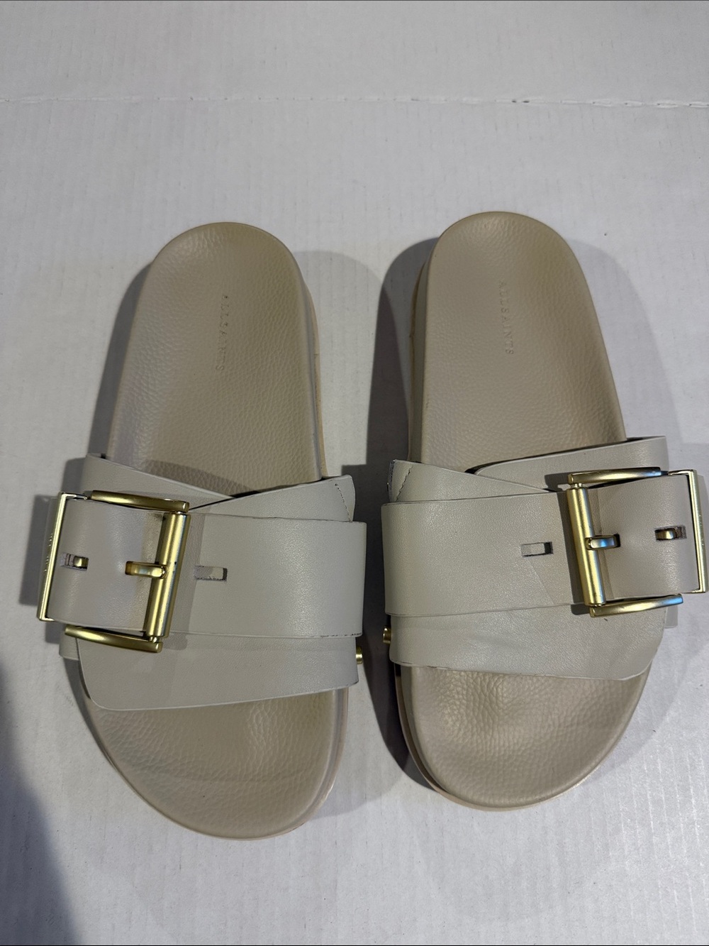 AllSaints Beige Slide Sandals with Gold Buckles